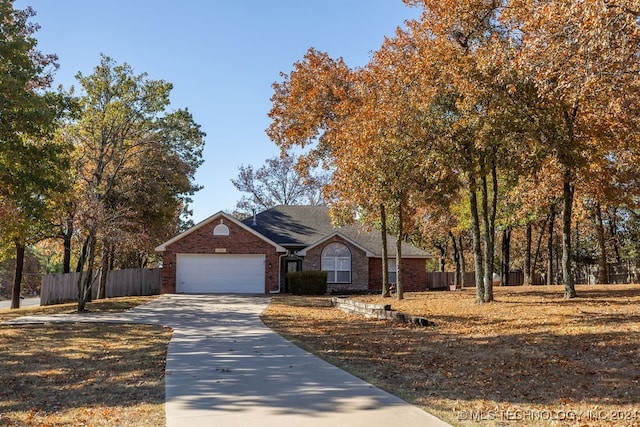 ranch-style home featuring a garage