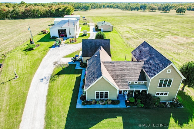 birds eye view of property with a rural view