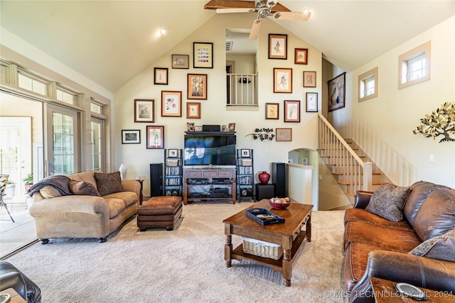 2009 W 100th St N, Wagoner, OK 74467 - living room featuring high vaulted ceiling, stairway, a ceiling fan, and carpet floors
