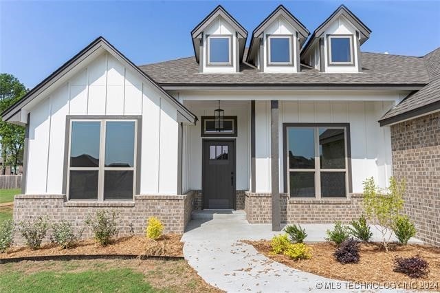 doorway to property with a porch