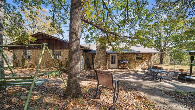 back of house with a patio area