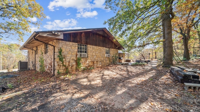 view of side of home with cooling unit