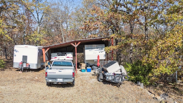 view of vehicle parking featuring a carport