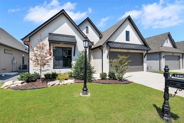 modern farmhouse with a garage and a front lawn