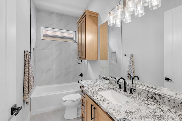 full bathroom with tile patterned flooring, vanity, toilet, and tiled shower / bath