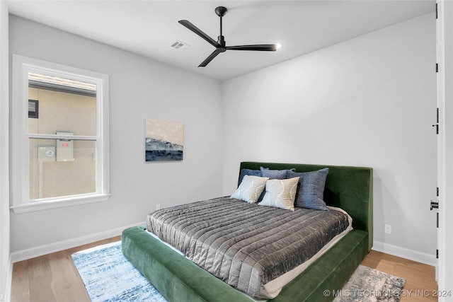 bedroom featuring hardwood / wood-style floors and ceiling fan