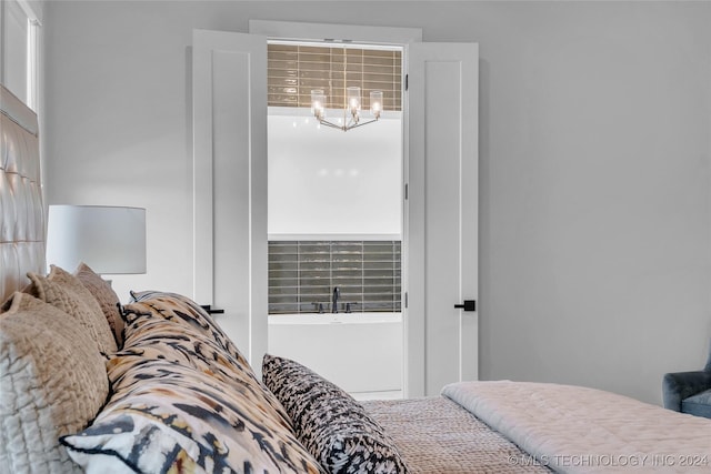 bedroom with a chandelier