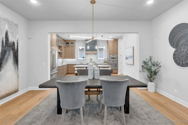 dining area featuring light wood-type flooring