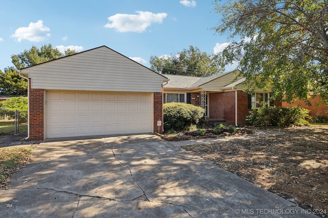 ranch-style house featuring a garage