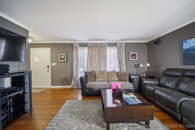 living room with ornamental molding and hardwood / wood-style floors