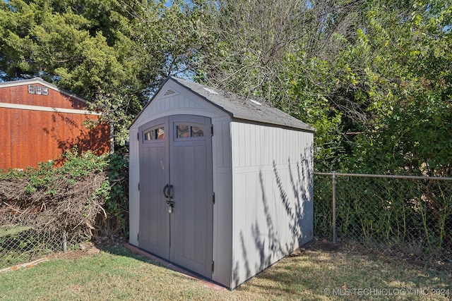 view of outdoor structure with a lawn