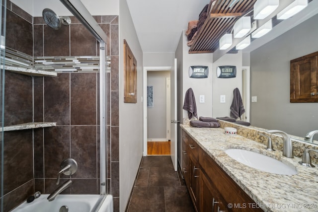 bathroom with vanity, tile patterned floors, and shower / bath combination with glass door