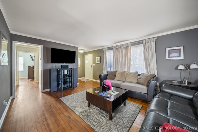 living room featuring ornamental molding and hardwood / wood-style floors