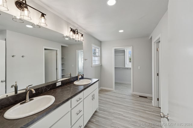 bathroom with vanity and hardwood / wood-style floors