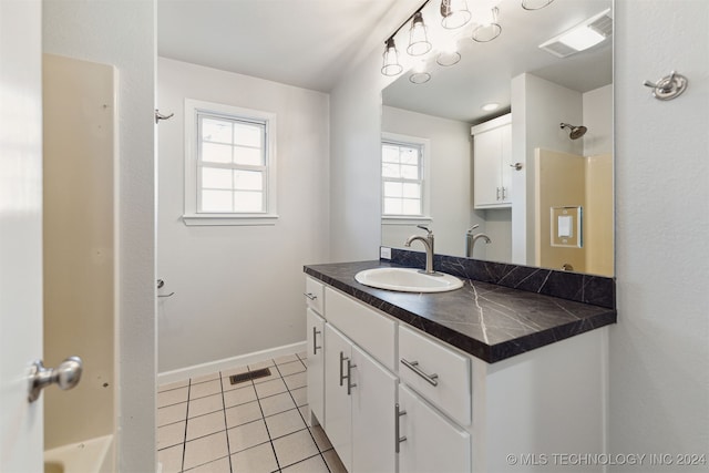 bathroom with vanity and tile patterned floors