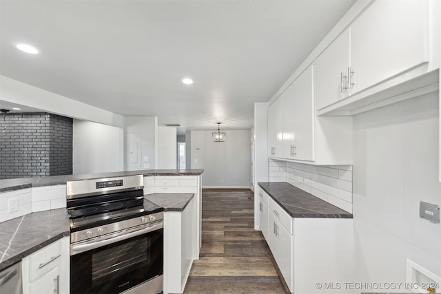 kitchen featuring white cabinetry, kitchen peninsula, backsplash, and stainless steel electric range