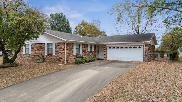 ranch-style home featuring a garage