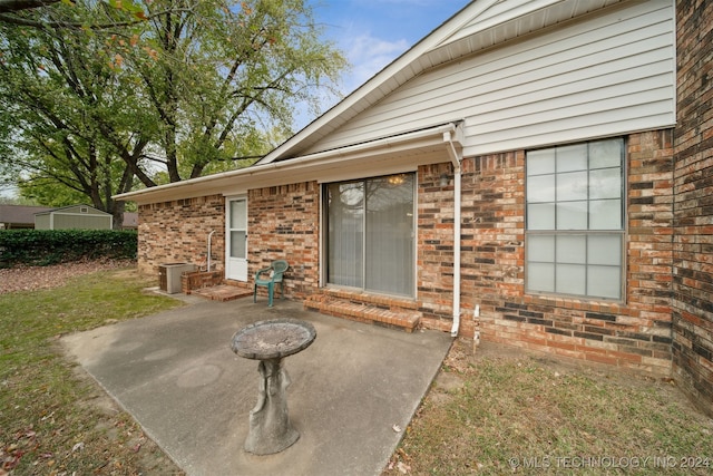 property entrance with a patio