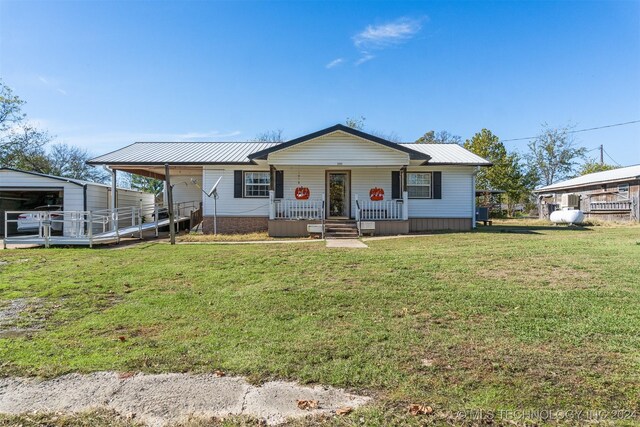 161 N Hickory, Tushka, OK 74525 - view of front of property featuring a porch and a front yard