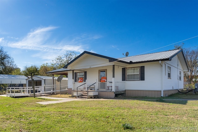 view of front of house featuring a front lawn and a porch