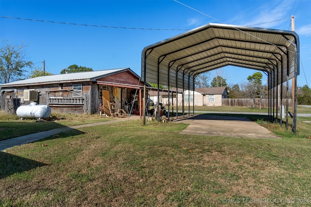 view of parking featuring a carport and a lawn