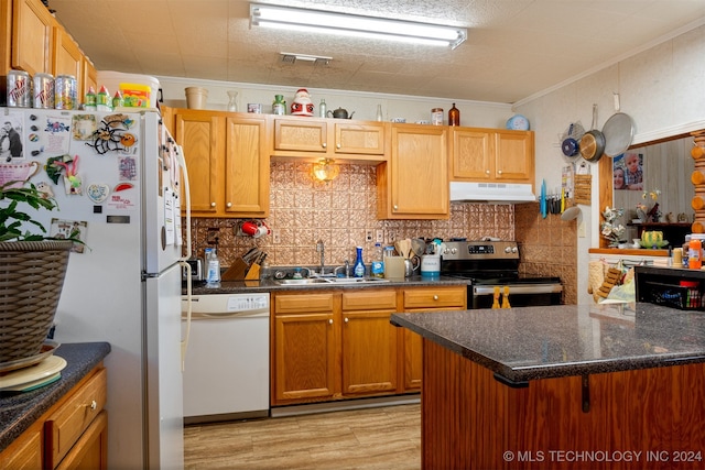 kitchen with sink, tasteful backsplash, light hardwood / wood-style floors, white appliances, and ornamental molding