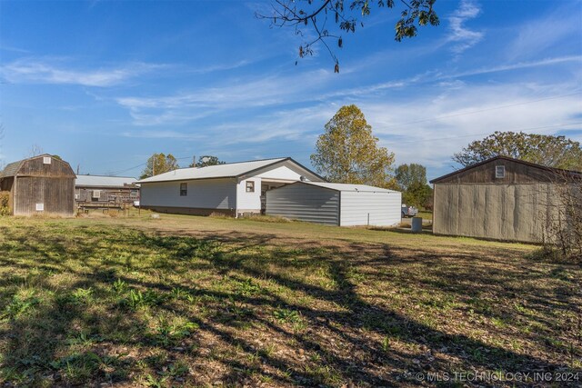 161 N Hickory, Tushka, OK 74525 - view of yard with an outdoor structure