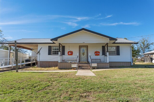 161 N Hickory, Tushka, OK 74525 - view of front of property featuring a porch and a front lawn