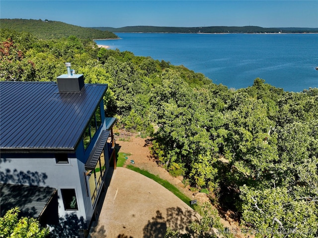 drone / aerial view with a water and mountain view