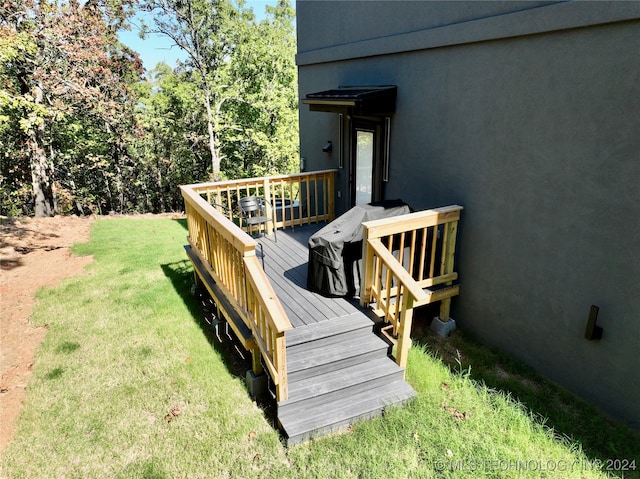 wooden deck with a yard