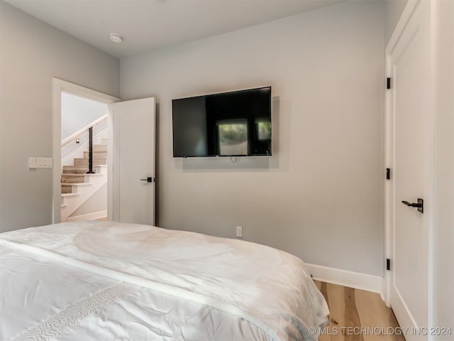 bedroom featuring hardwood / wood-style floors