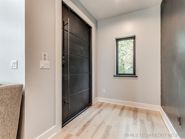 entryway with light hardwood / wood-style floors