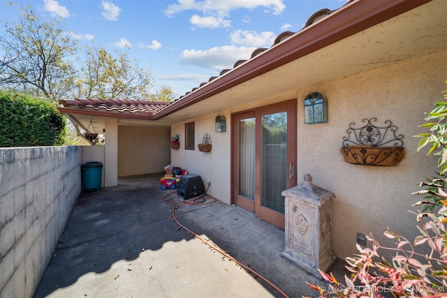 doorway to property with a patio