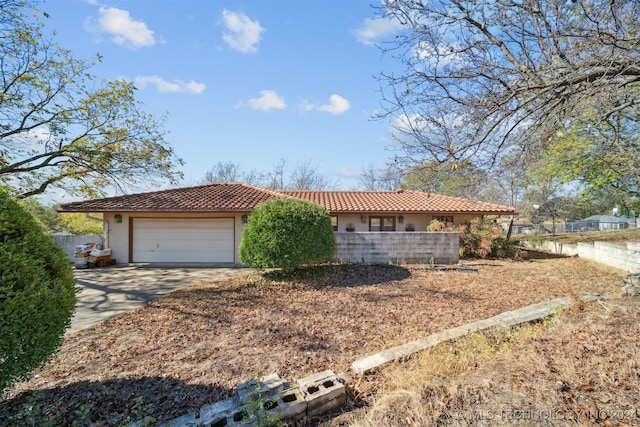 ranch-style home featuring a garage