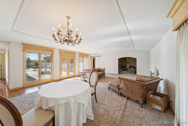 dining area with an inviting chandelier and light tile patterned floors