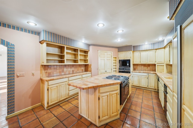 kitchen featuring a kitchen island, tile patterned flooring, tile countertops, black appliances, and tasteful backsplash