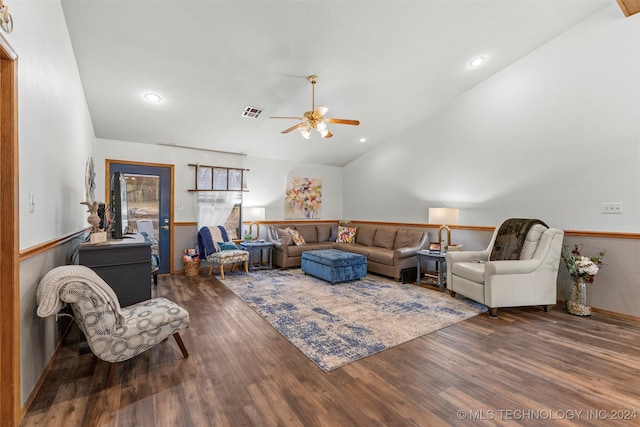 living room with lofted ceiling, ceiling fan, and dark hardwood / wood-style flooring