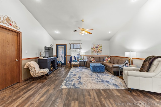 living room with lofted ceiling, dark wood-type flooring, and ceiling fan