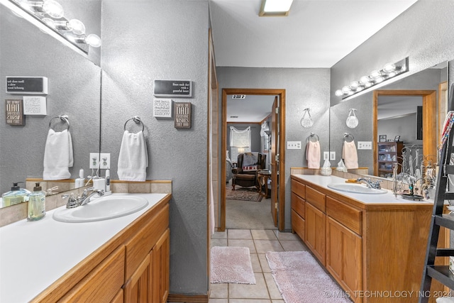 bathroom with vanity and tile patterned flooring