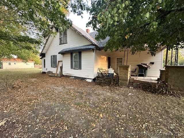 rear view of house featuring a patio area