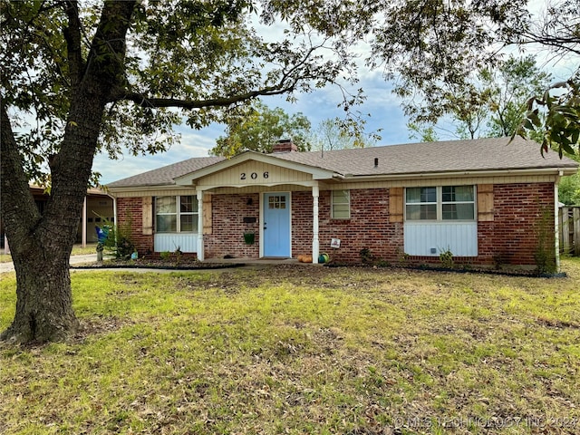 ranch-style home featuring a front yard