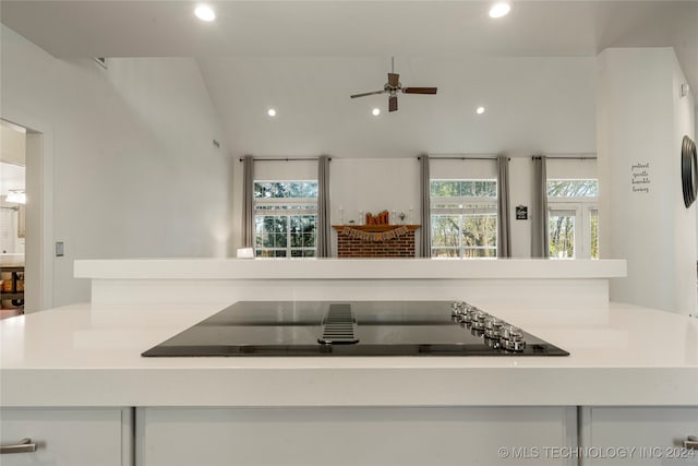 kitchen featuring ceiling fan and black electric stovetop