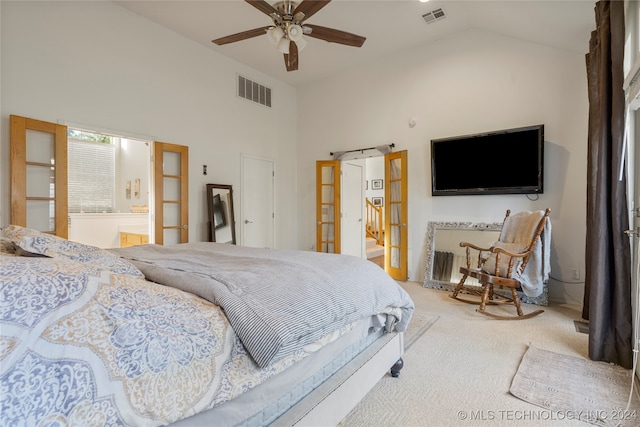 bedroom with ensuite bathroom, ceiling fan, high vaulted ceiling, and carpet floors