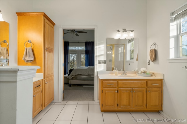 bathroom with vanity, an enclosed shower, tile patterned floors, and ceiling fan