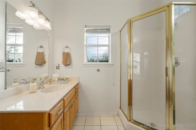 bathroom with vanity, walk in shower, and tile patterned floors