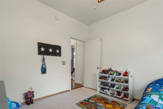 playroom with carpet floors and ceiling fan