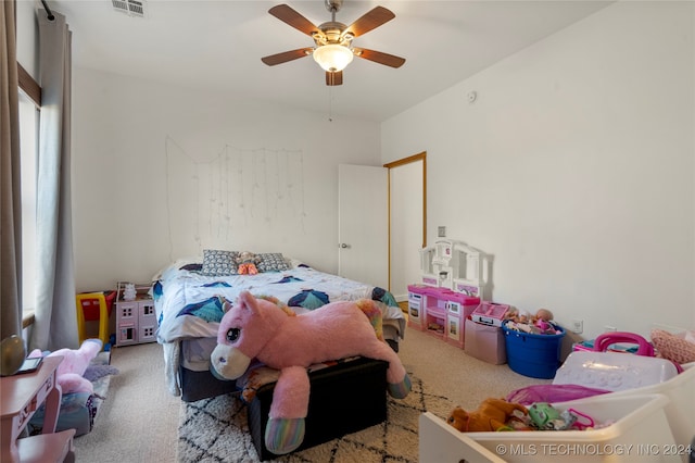 bedroom with multiple windows, carpet flooring, and ceiling fan