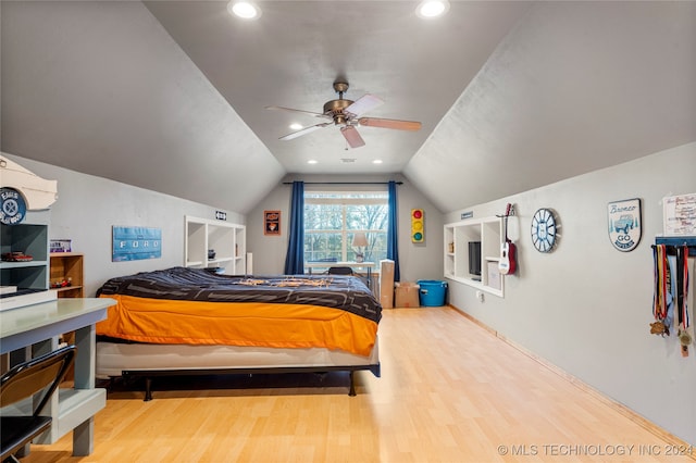 bedroom with lofted ceiling, hardwood / wood-style flooring, and ceiling fan