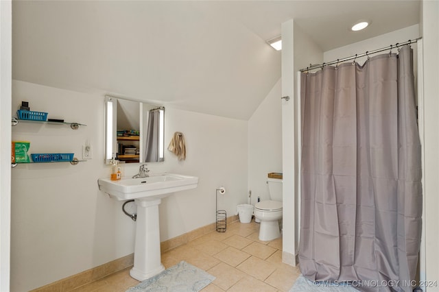 bathroom featuring a shower with shower curtain, tile patterned floors, toilet, and sink