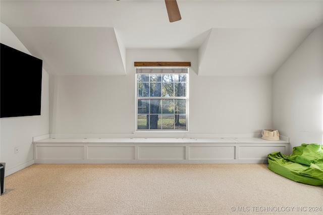 bonus room featuring vaulted ceiling, light carpet, and ceiling fan